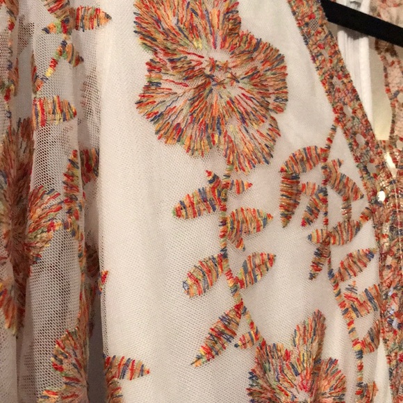 white dress with multicolor embroidery